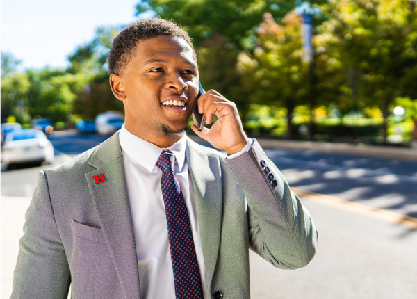 student on phone outside